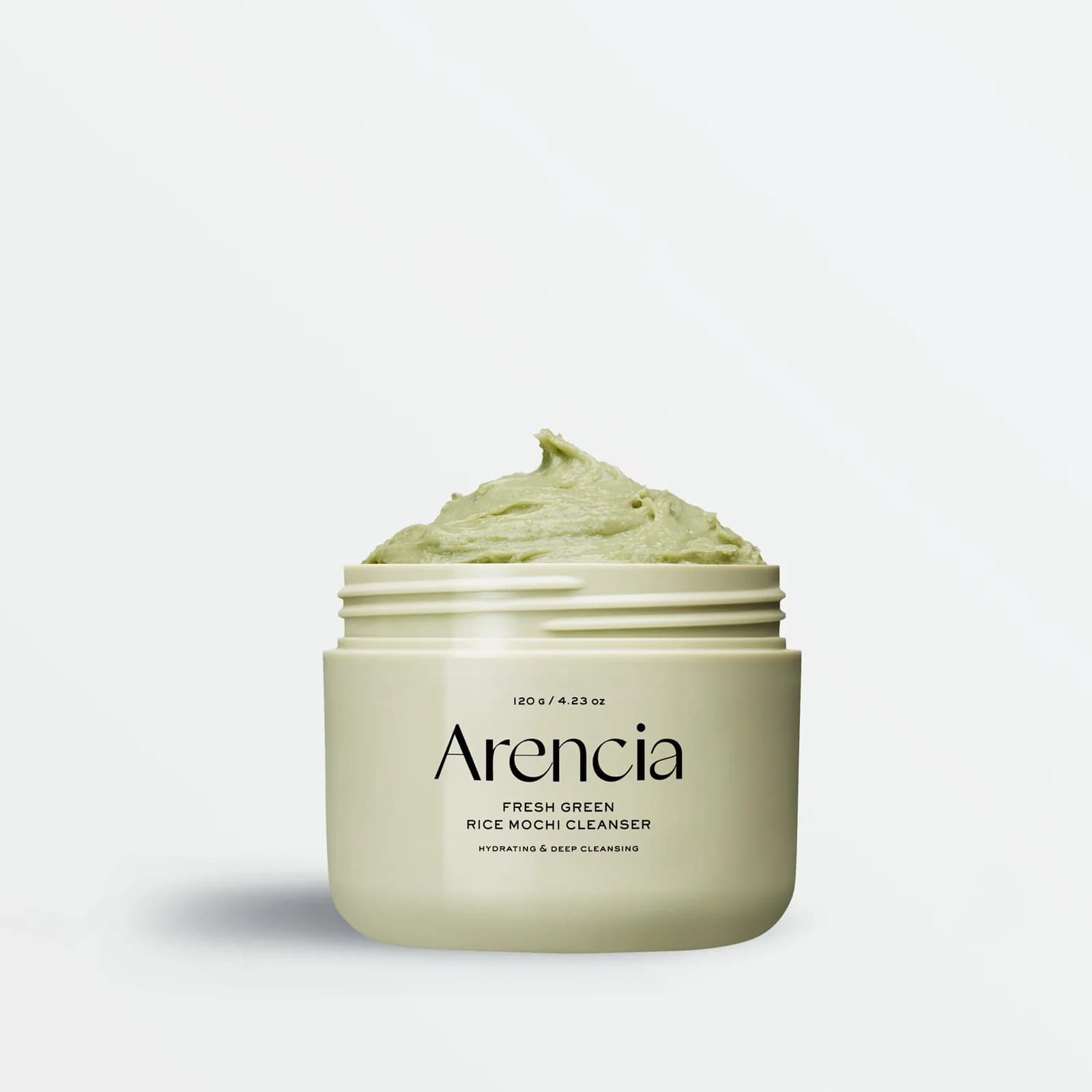 Limpiador facial de textura tipo mochi, con arroz verde, que limpia profundamente y purifica poros sin sensación de resequedad.